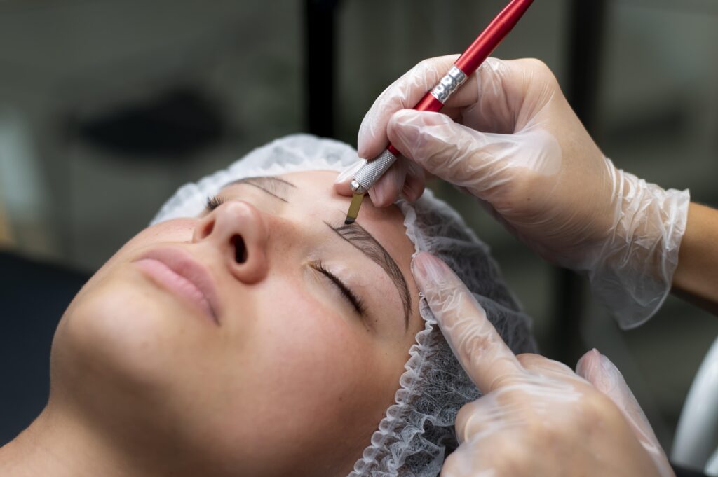 beautician doing microblading procedure young woman